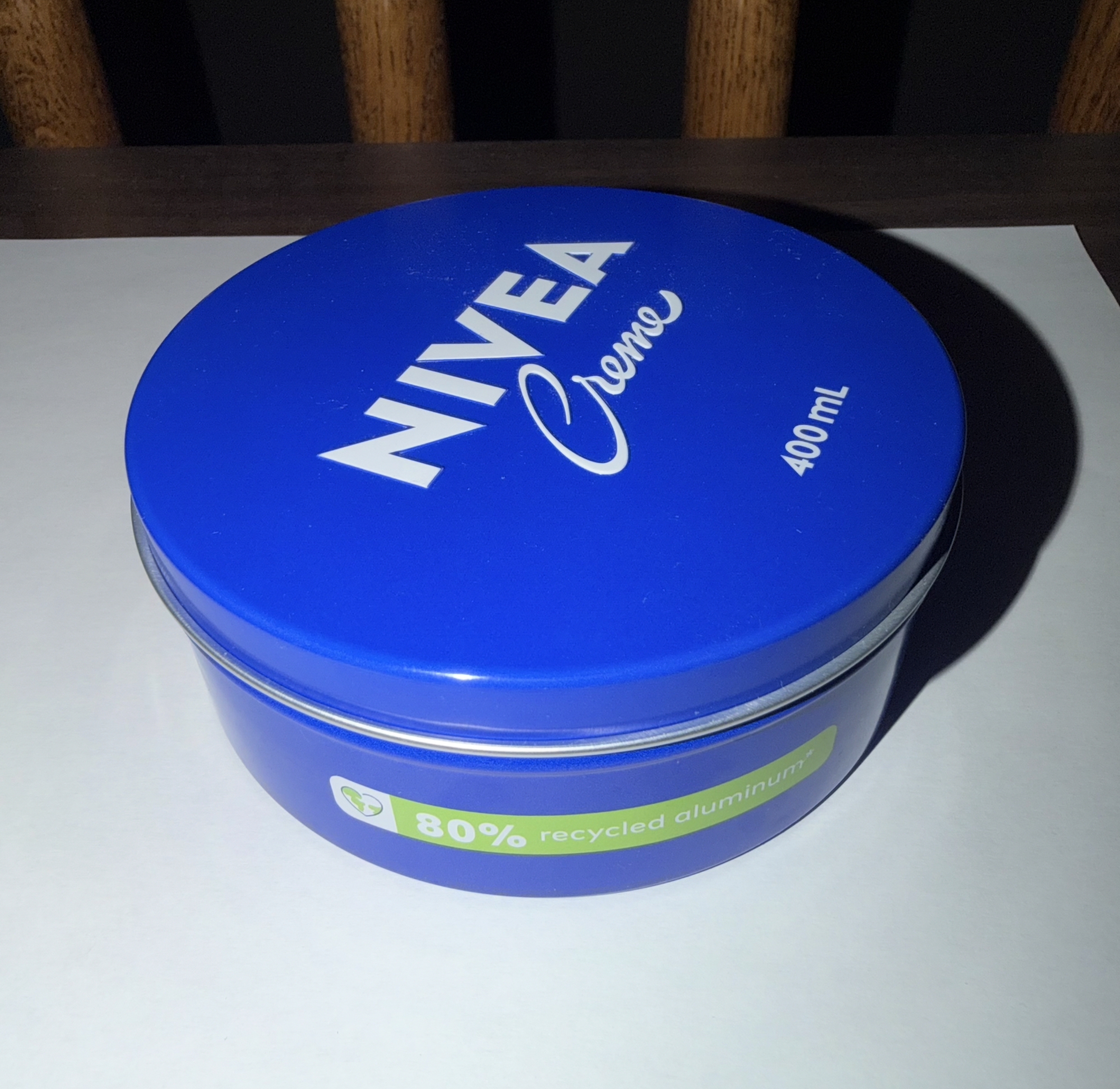 Nivea Cream in a Cylindical Container, front-facing.